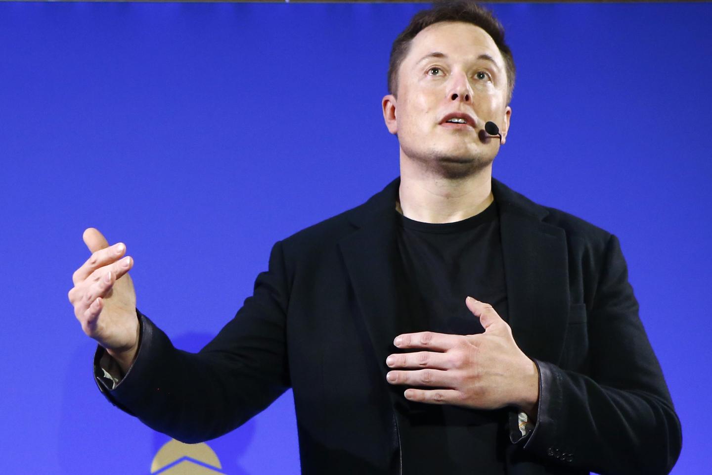 Tesla CEO Elon Musk speaks at a conference
