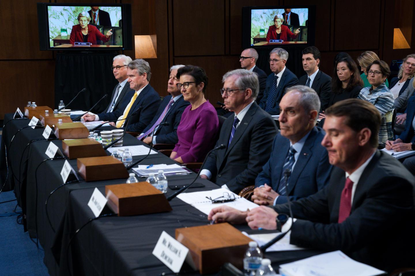 Sen. Elizabeth Warren, D-Mass., on a screen in the background, questions witnesses about Zelle, during a Senate Banking Committee annual Wall Street oversight hearing, Sept. 22, 2022, on Capitol Hill in Washington. 