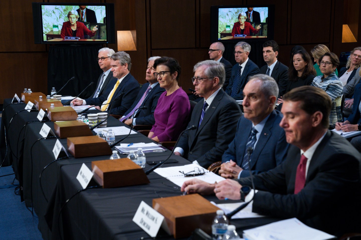 Sen. Elizabeth Warren, D-Mass., on a screen in the background, questions witnesses about Zelle, during a Senate Banking Committee annual Wall Street oversight hearing, Sept. 22, 2022, on Capitol Hill in Washington.