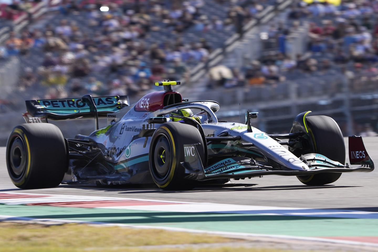 Lewis Hamilton, of Britain, steers through a turn during the first practice session for the Formula One U.S. Grand Prix auto race