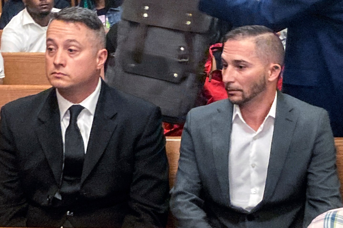 Jacob Runyan, left, and Chase Cominsky, sit in court as they are arraigned, Oct. 26, 2022, in Cleveland. The two pleaded not guilty to cheating and other charges in a lucrative fishing tournament on Lake Erie in the end of September where they were accused of stuffing five walleye with lead weights and fish filets.
