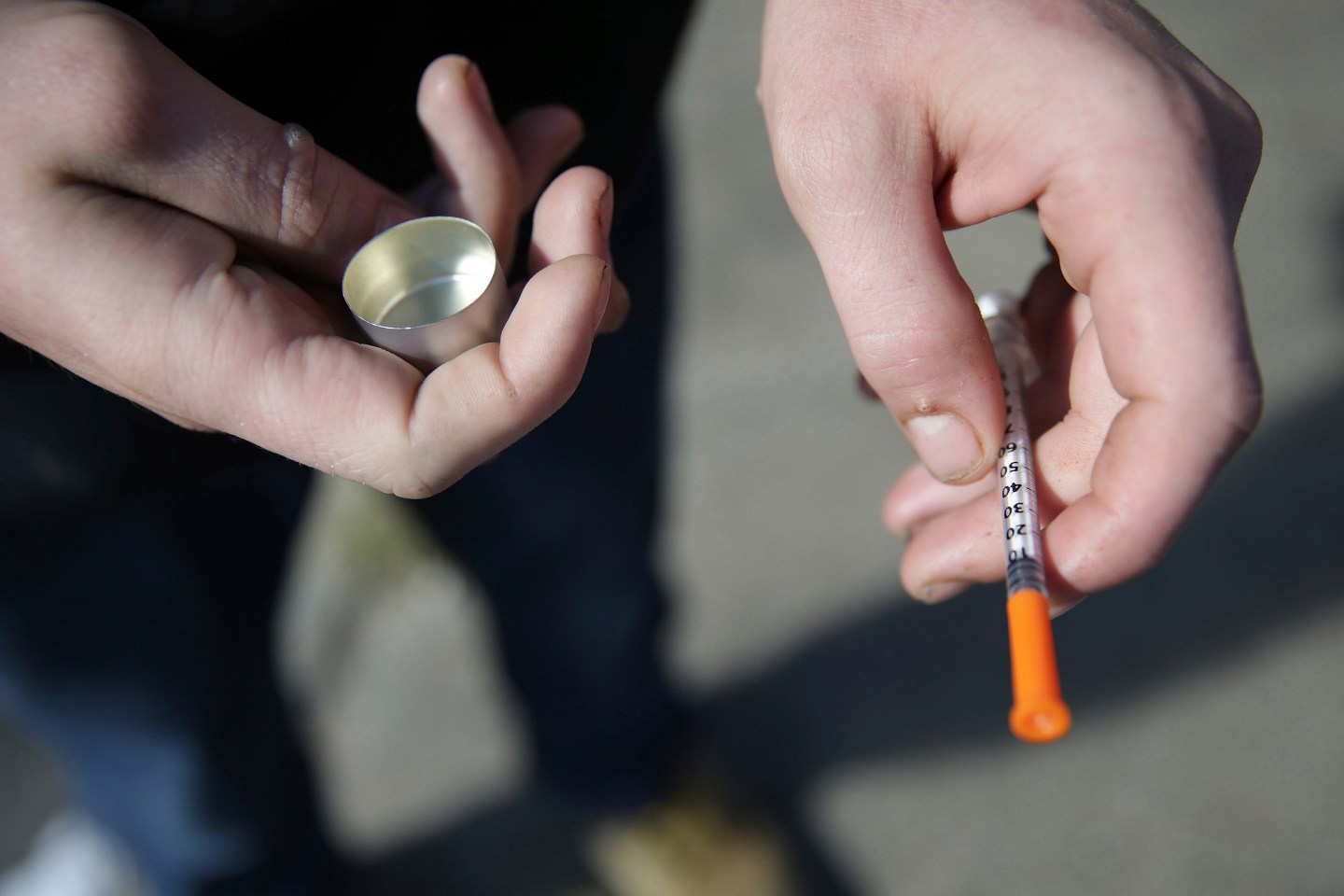 A fentanyl user holds a needle in Philadelphia this month.