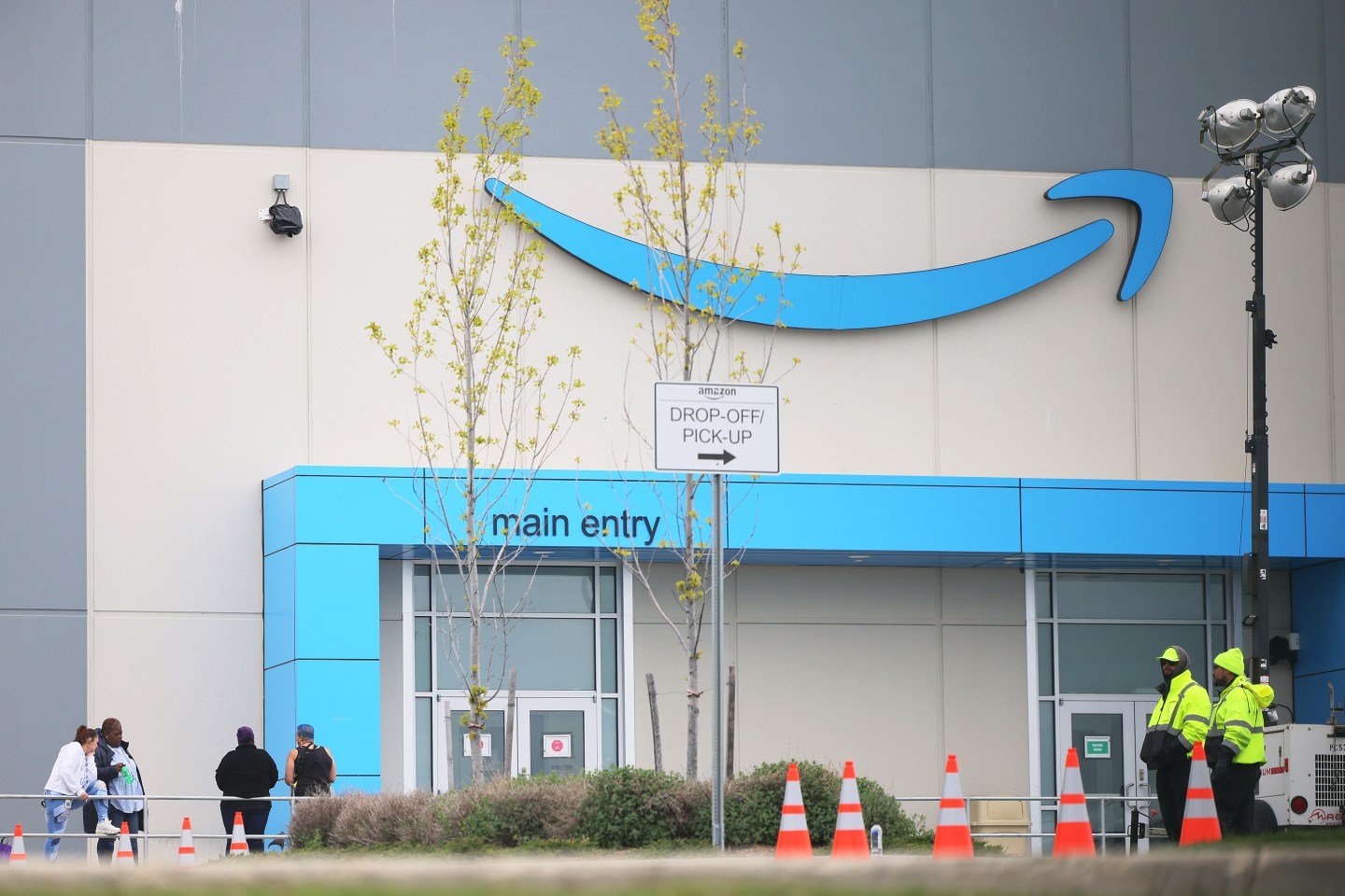 People congregate outside of the LDJ5 Amazon Sort Center on April 25, 2022 in New York City.