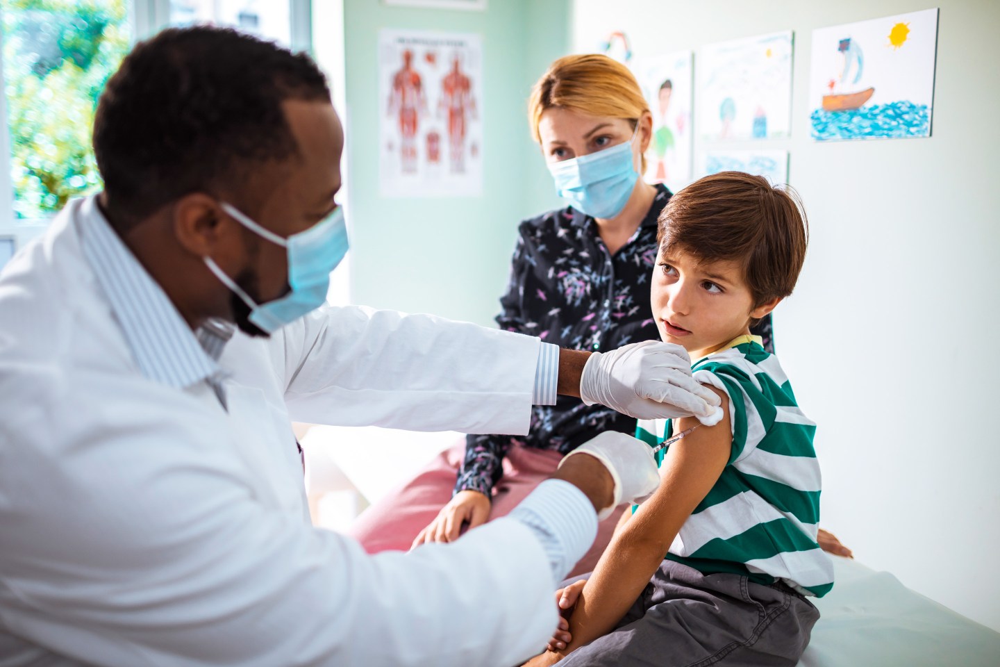 Little boy getting vaccinated at the Pediatrician's office