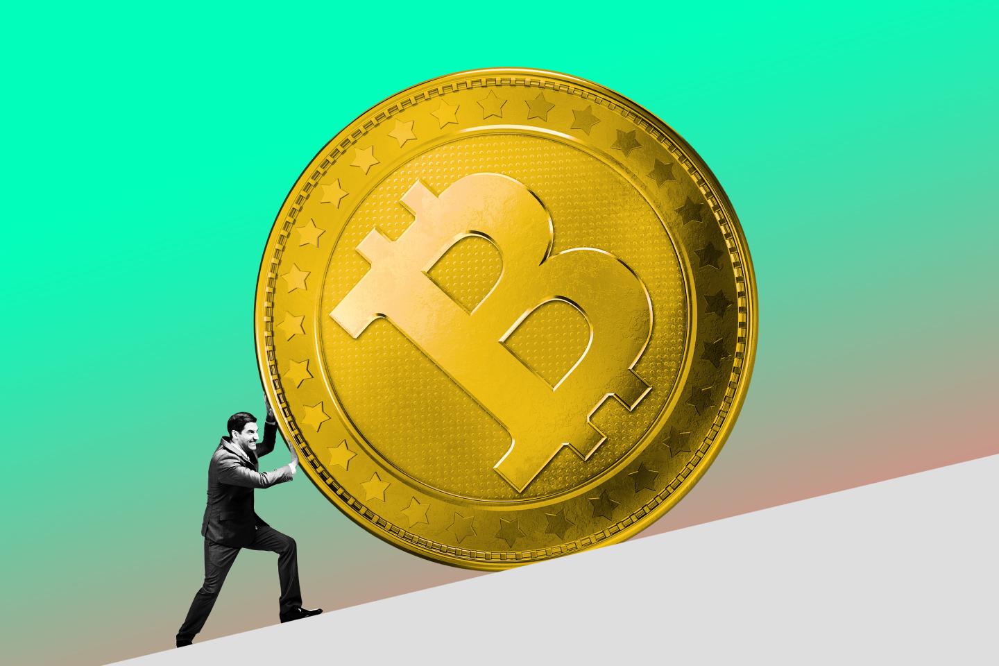 Man pushing a bitcoin up an incline