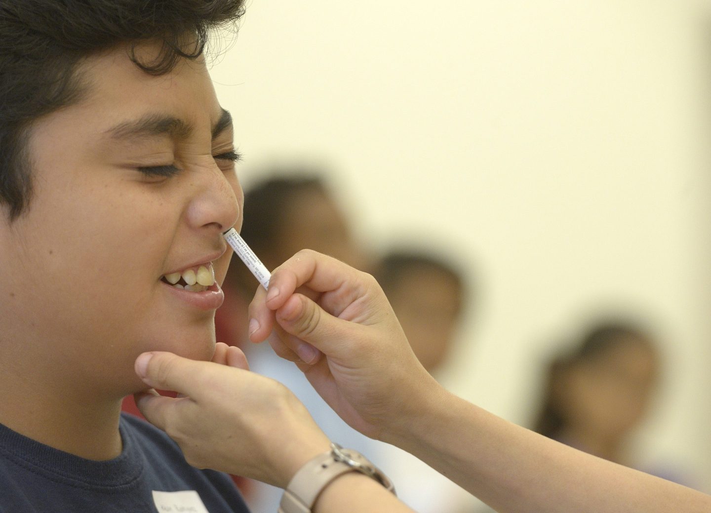 A student receives a FluMist influenza vaccine in Anaheim, Calif., in 2015.