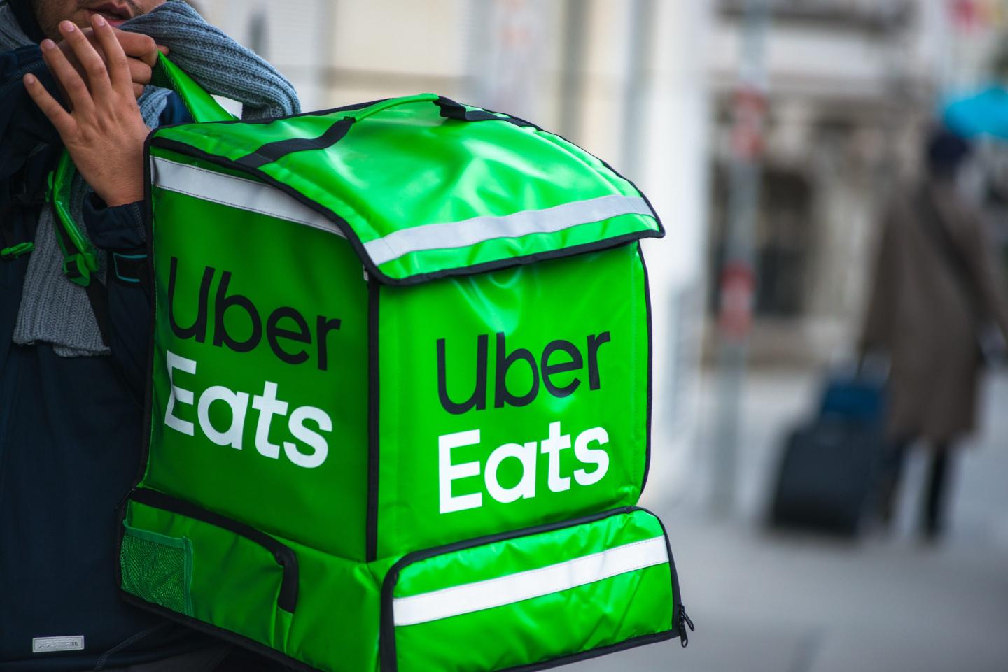 An Uber Eats bag carried on a shoulder.
