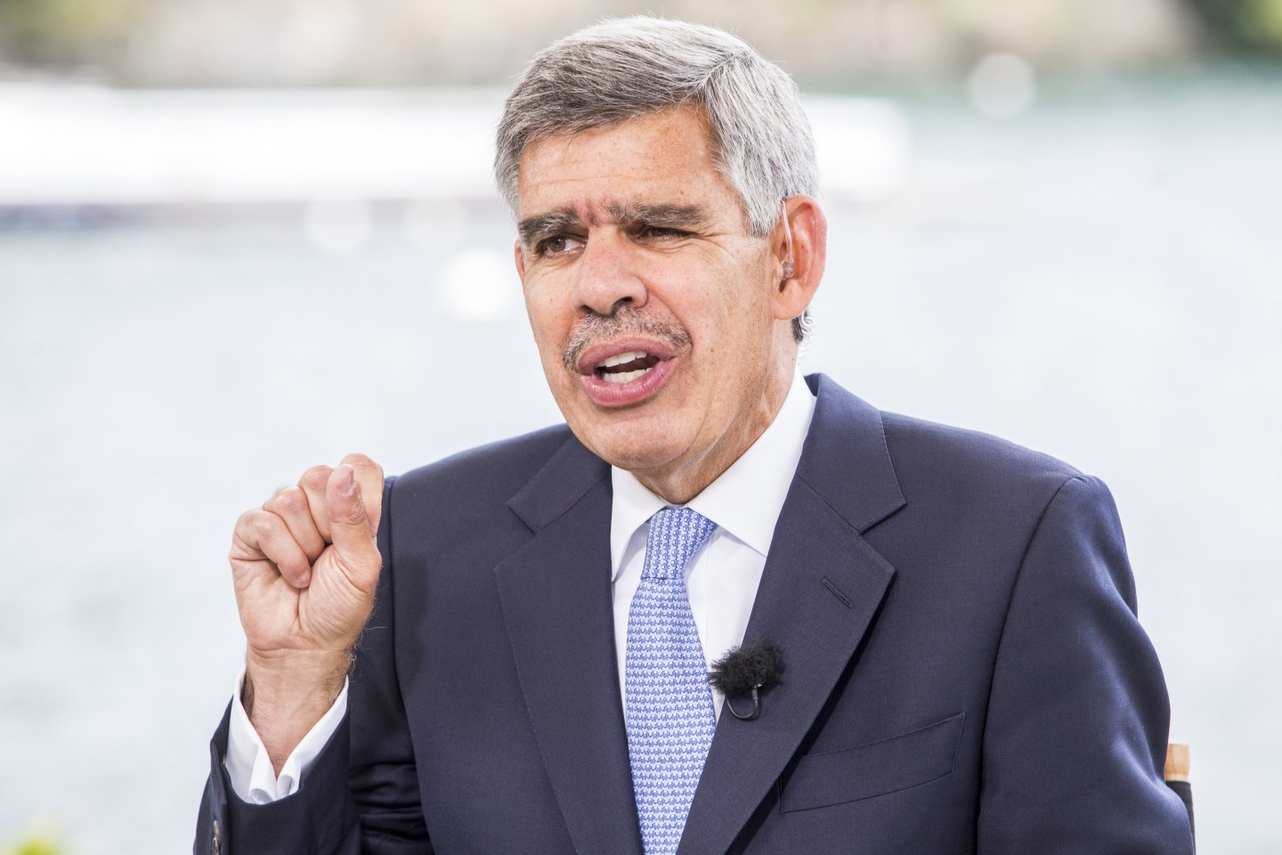 Shot of economist Mohamed El-Erian speaking at an event in Italy