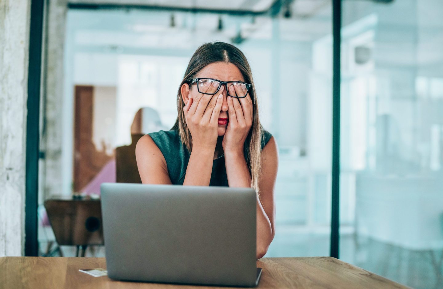 Stressed-out woman in front of laptop