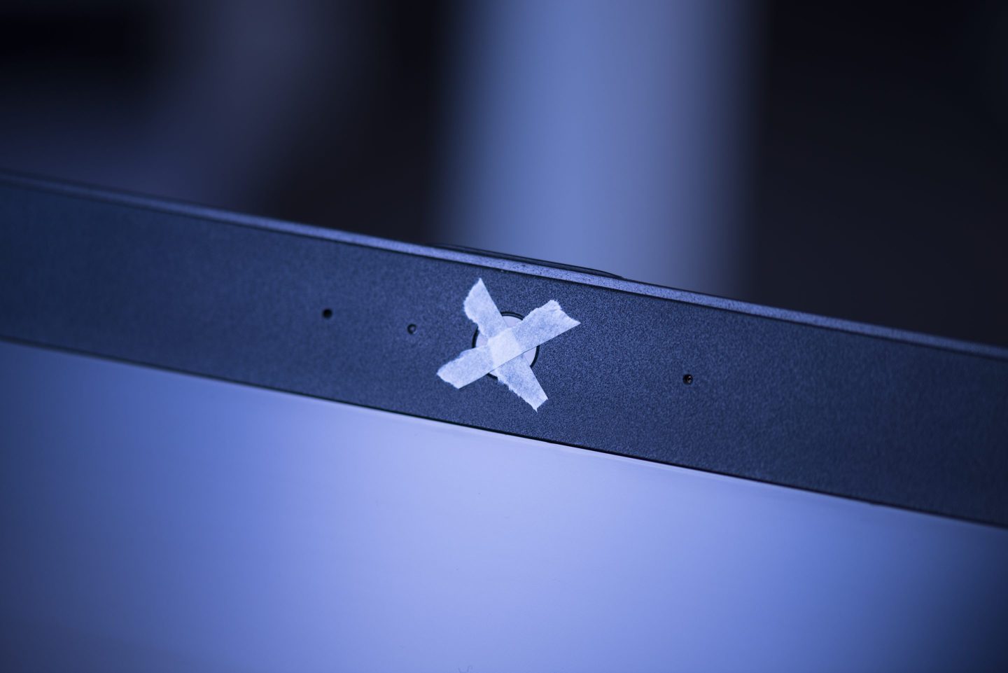 Notebook or laptop camera covered with adhesive tape