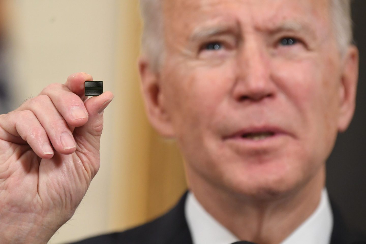 President Joe Biden holds a computer chip