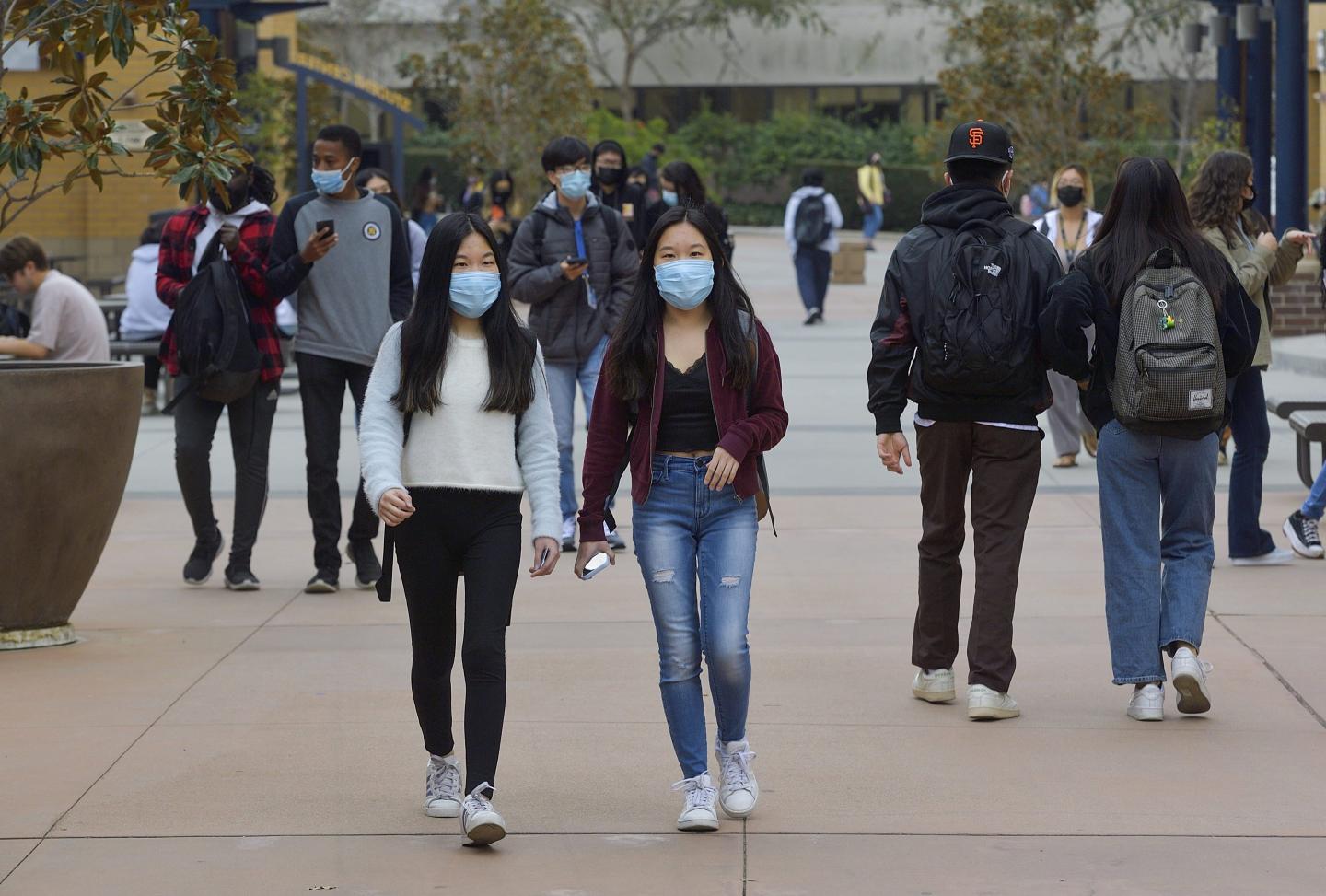 Photo of students on UCI's campus.