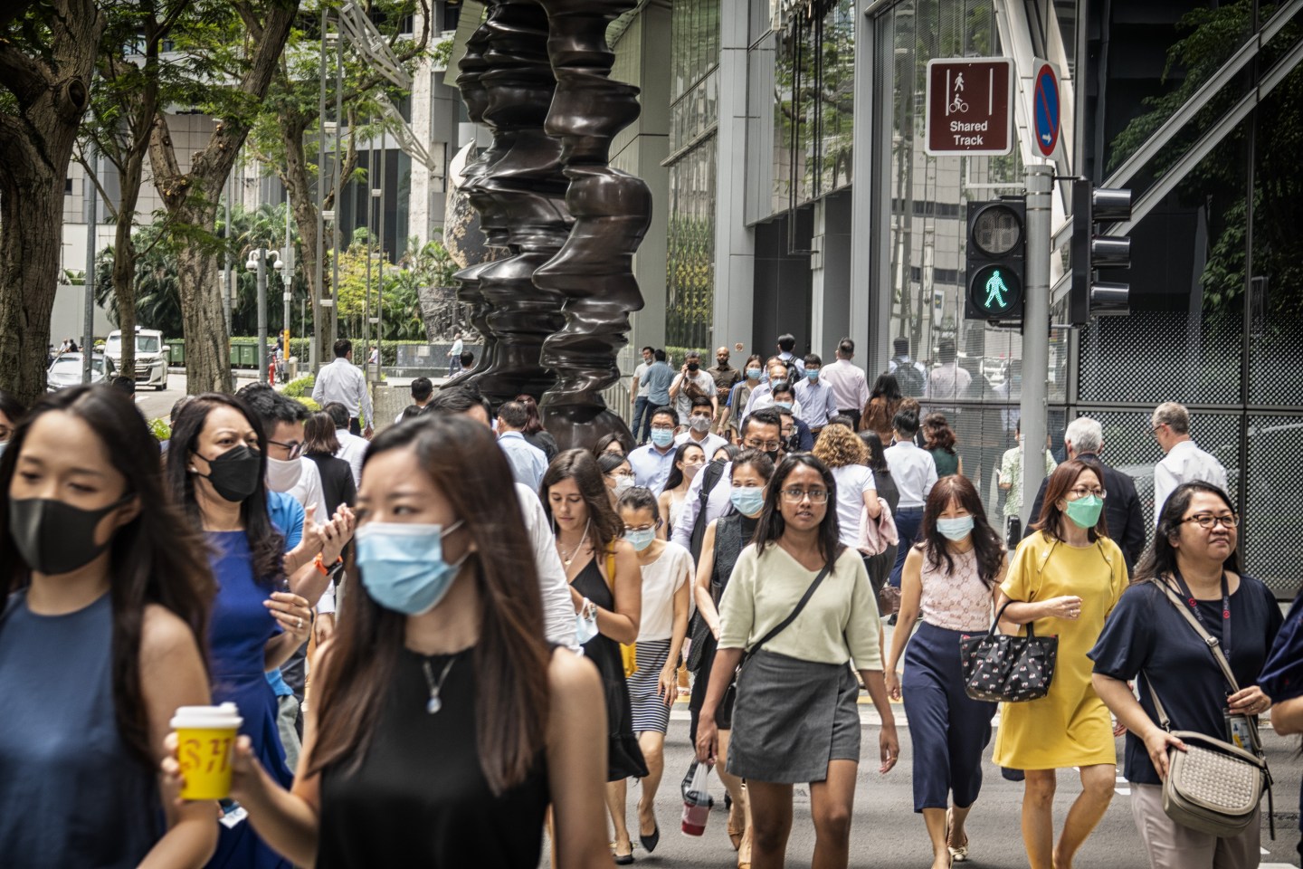 Pedestrians in the central business district of Singapore, April 2022.