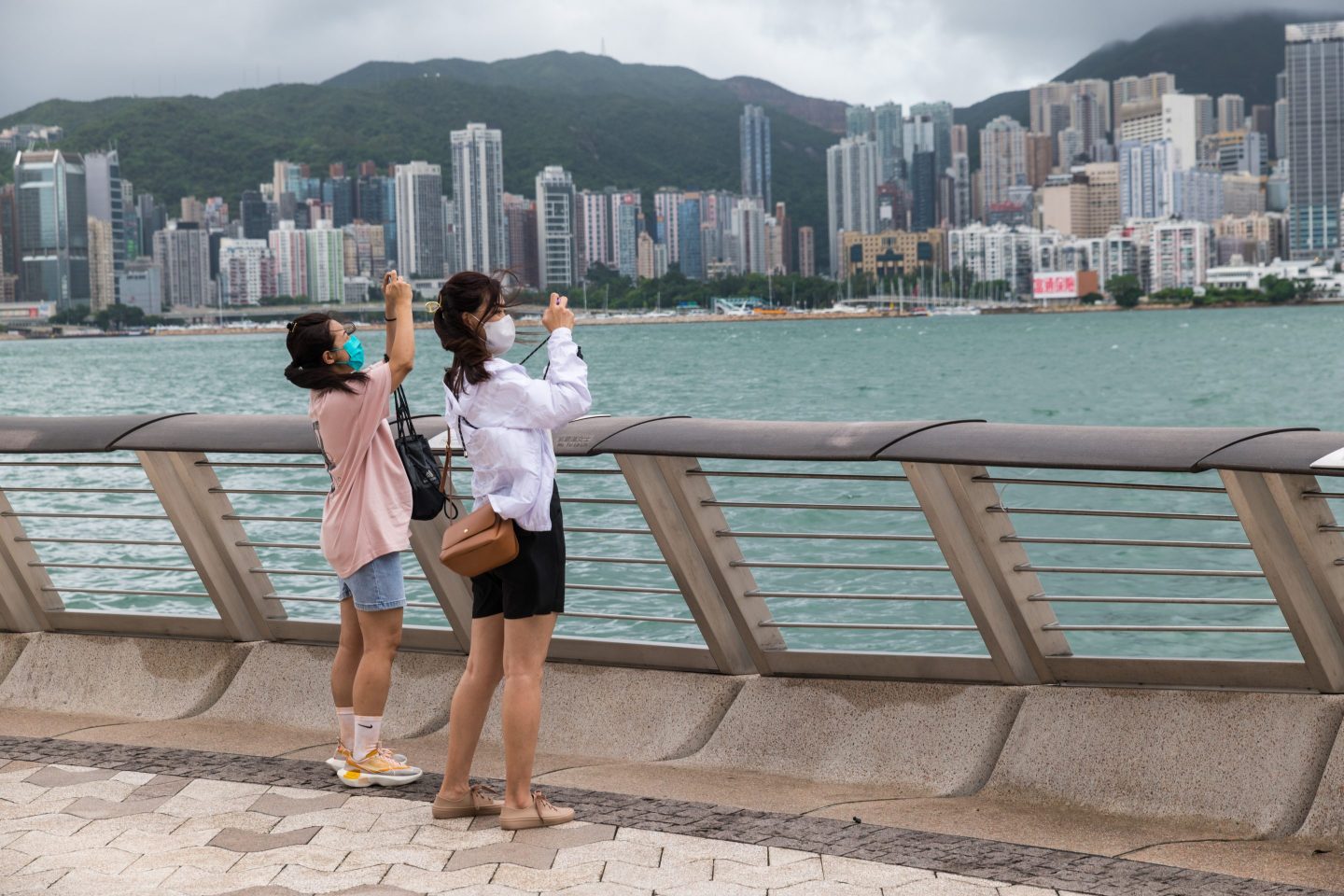 Two women take photos at Hong Kong's Avenue of Stars