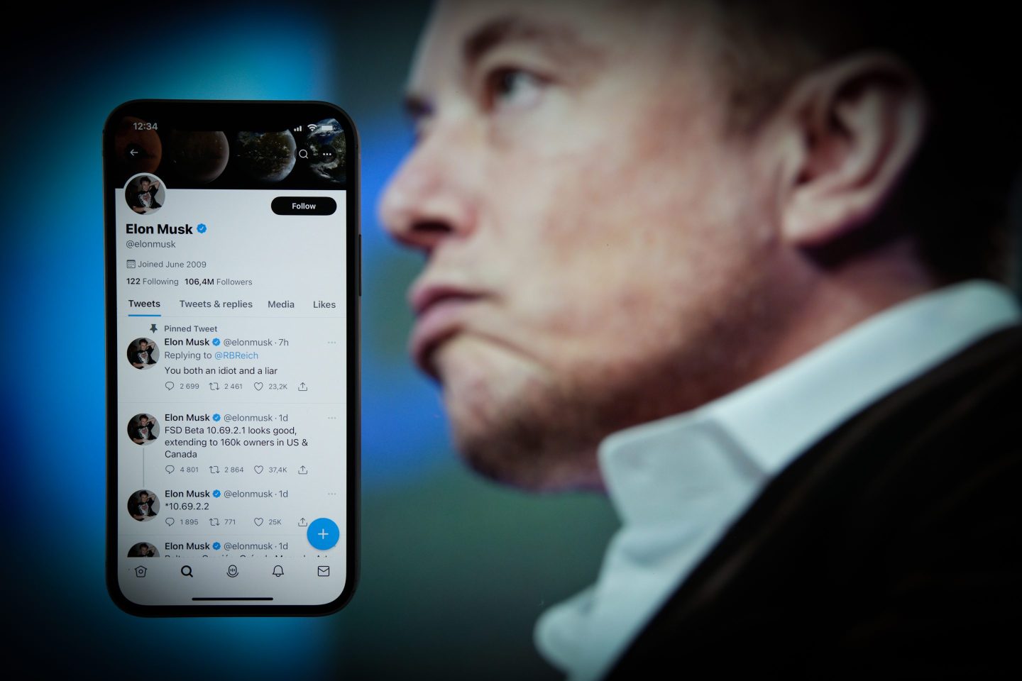 Elon Musk is seen on an Apple iPhone mobile phone