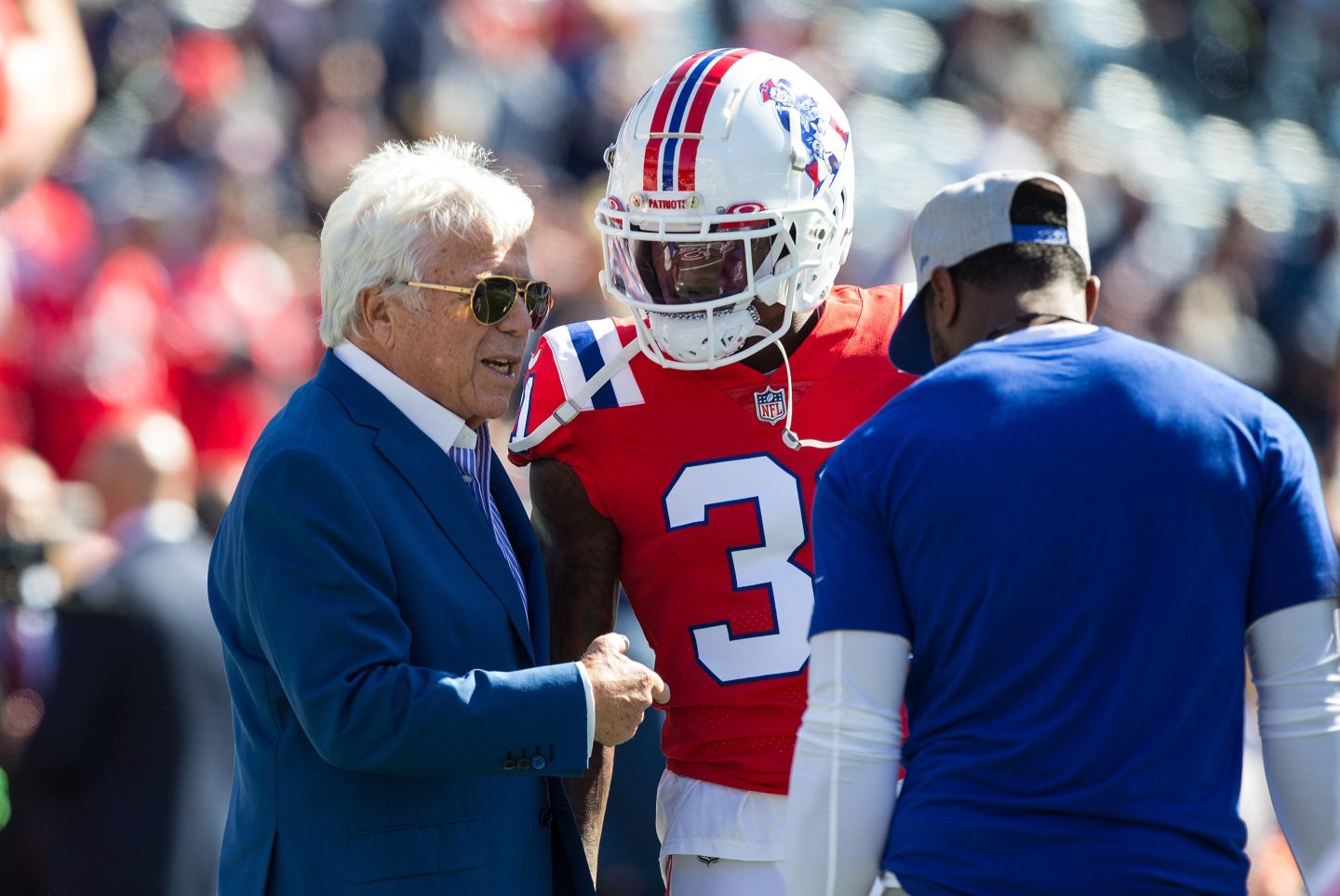 New England Patriots owner Robert Kraft speaks with New England Patriots cornerback Jonathan Jones.