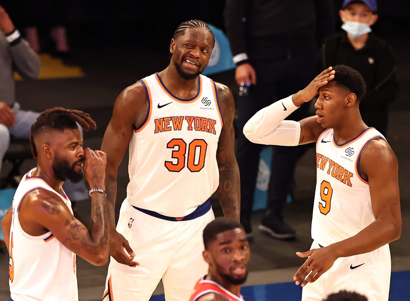 Julius Randle #30 Nerlens Noel #3 and RJ Barrett #9 of the New York Knicks react