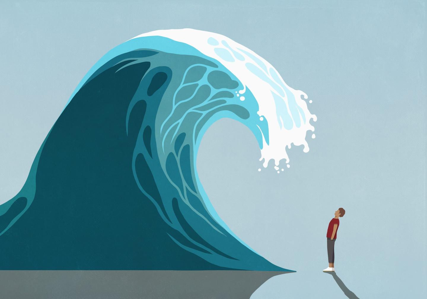 Man facing huge ocean tidal wave