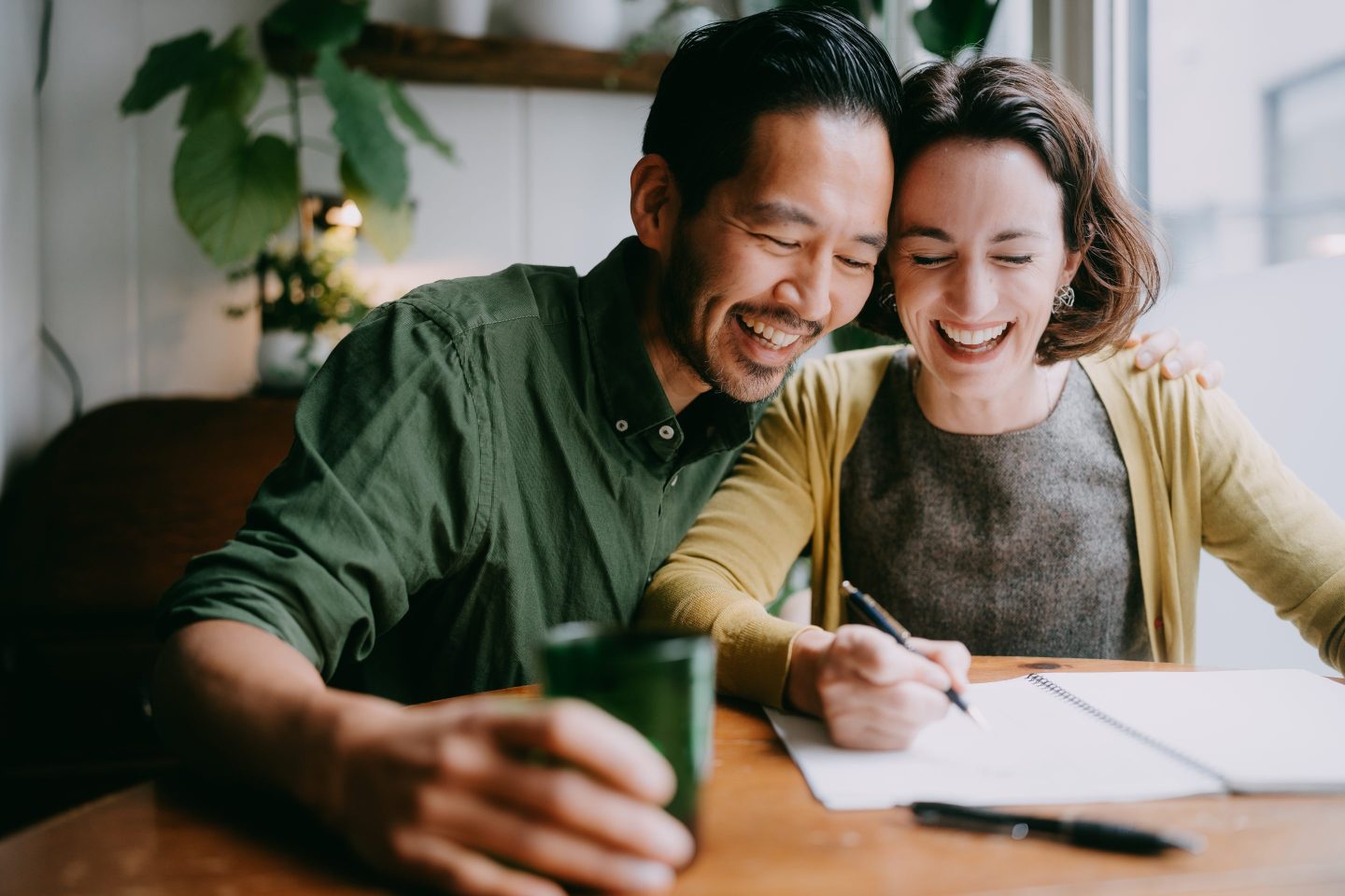 Cheerful couple planning their future home