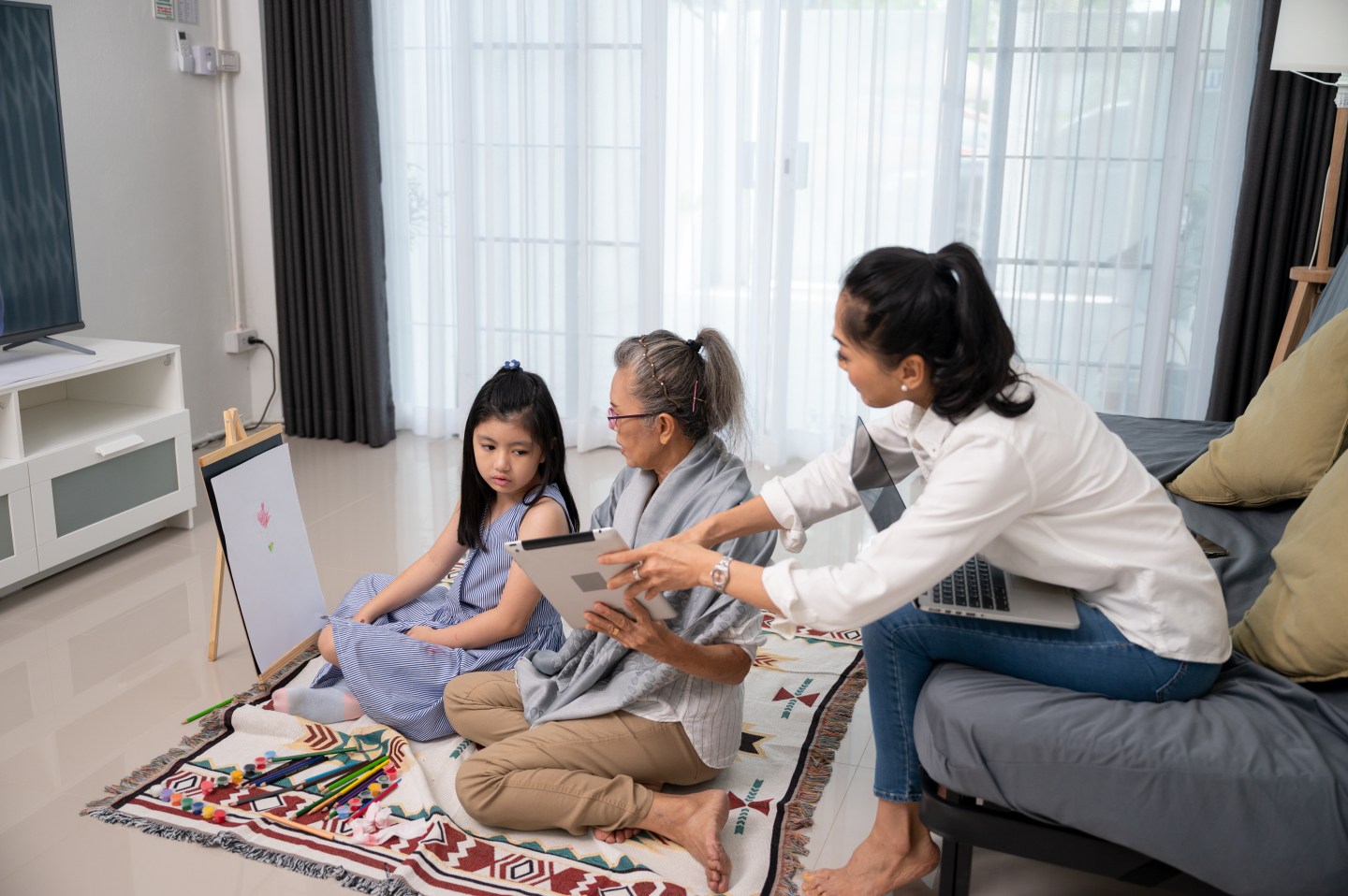 woman with mother and child at home