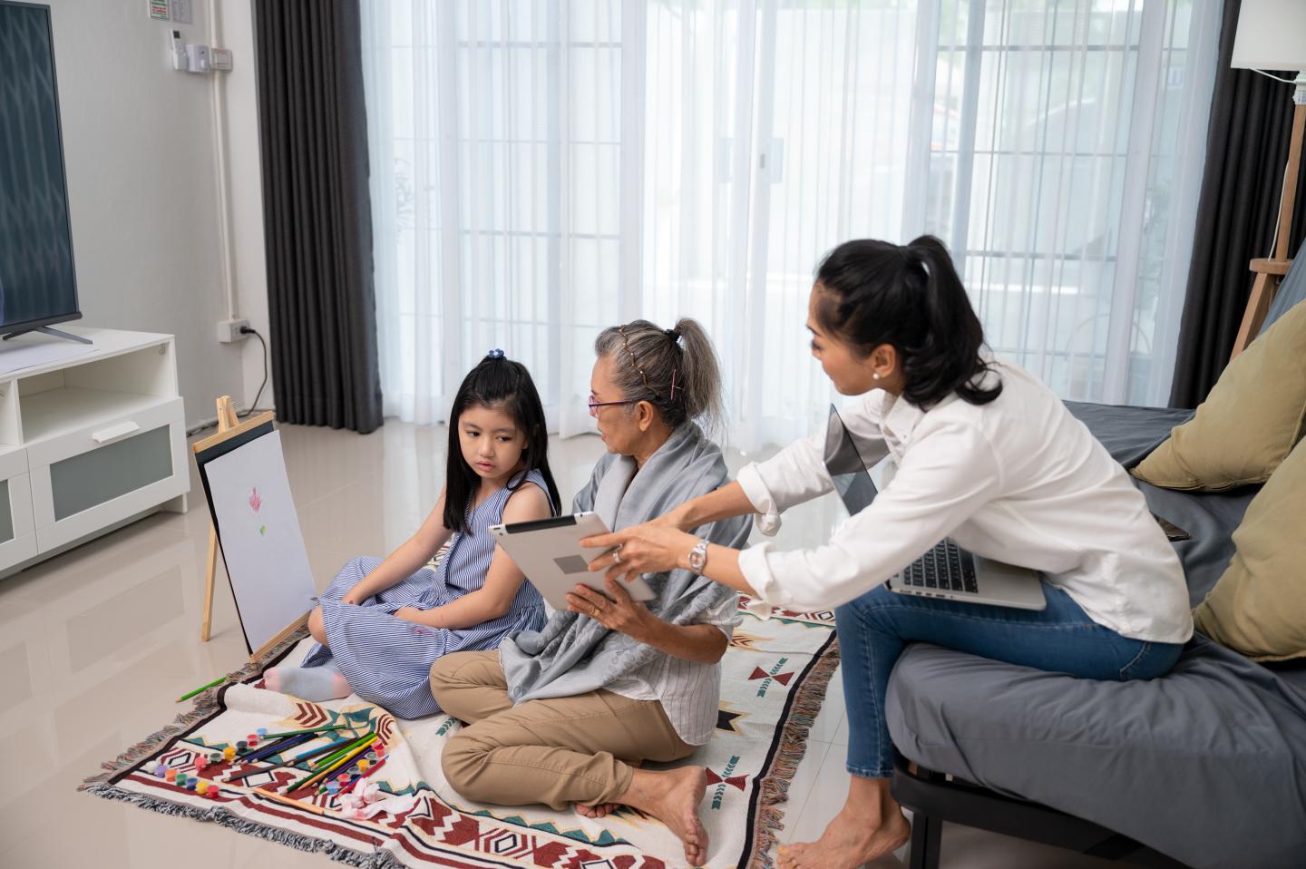 woman with mother and child at home