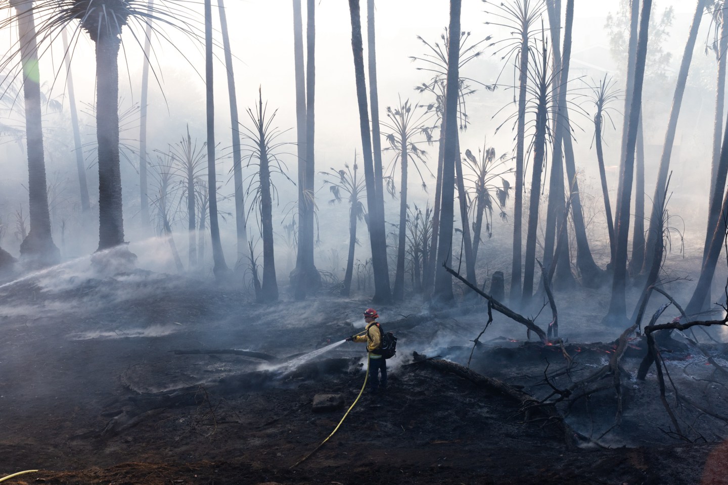 A firefighter battles a brush fire on June 17 in California’s Jurupa Valley.