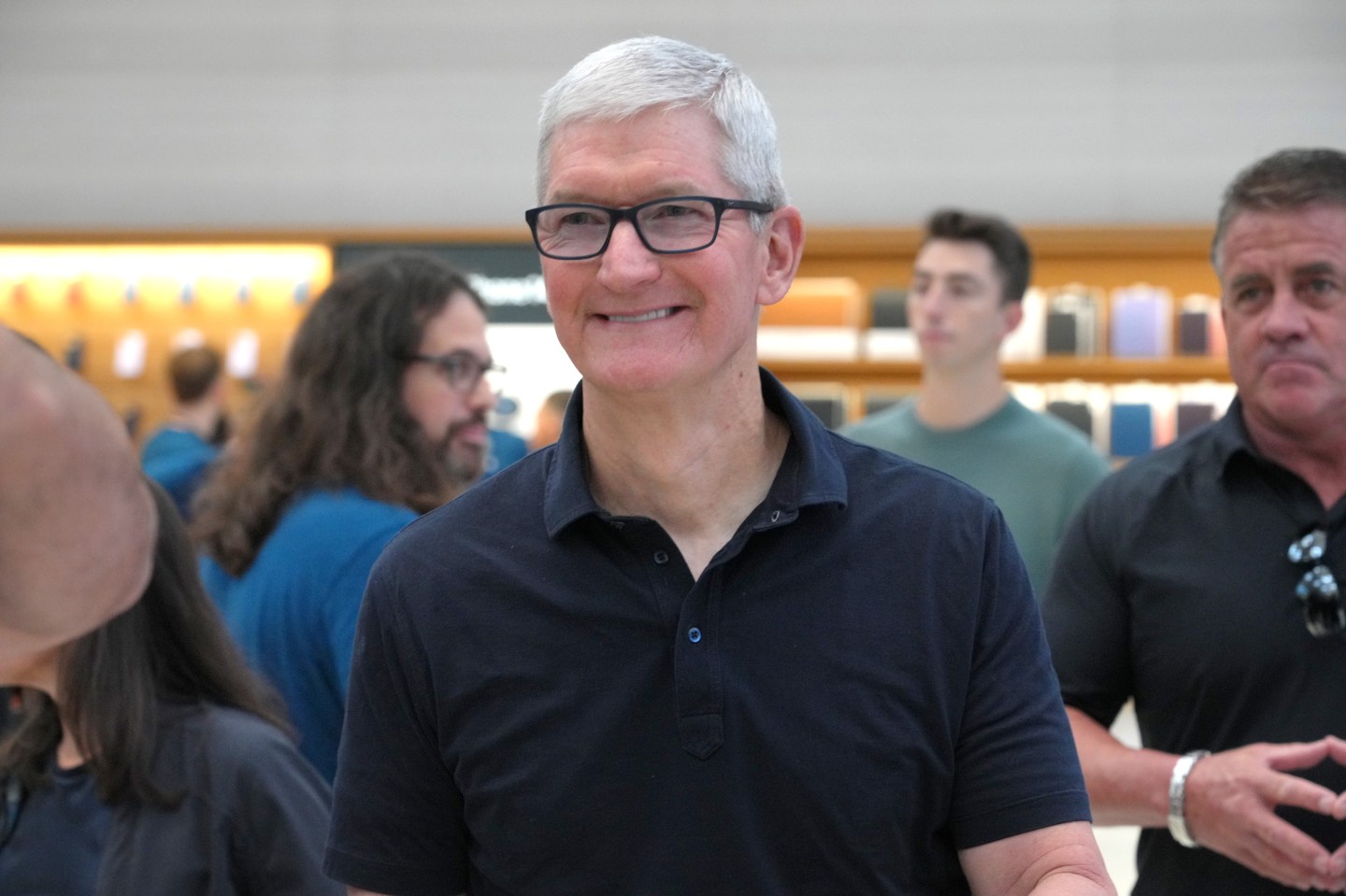 Shot of Apple CEO Tim Cook smiling in the Fifth Avenue Apple Store in New York