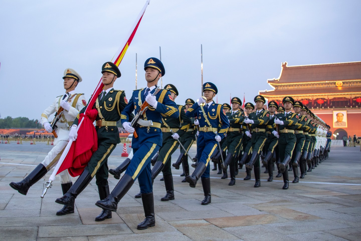 The Guard of Honor of the Chinese People's Liberation Army escorts the Chinese national flag during a flag-raising ceremony in celebration of the 73rd anniversary of of the founding of the People's Republic of China at Tian'anmen Square on October 1, 2022 in Beijing, China.