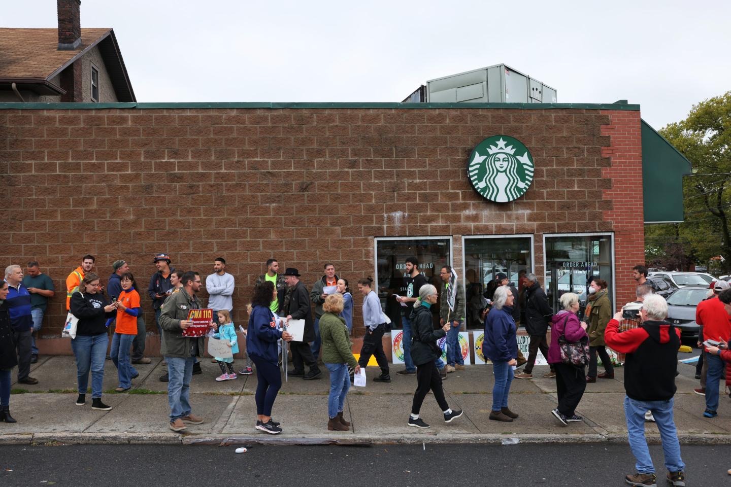 Photo of a rally outside of a Starbucks store.