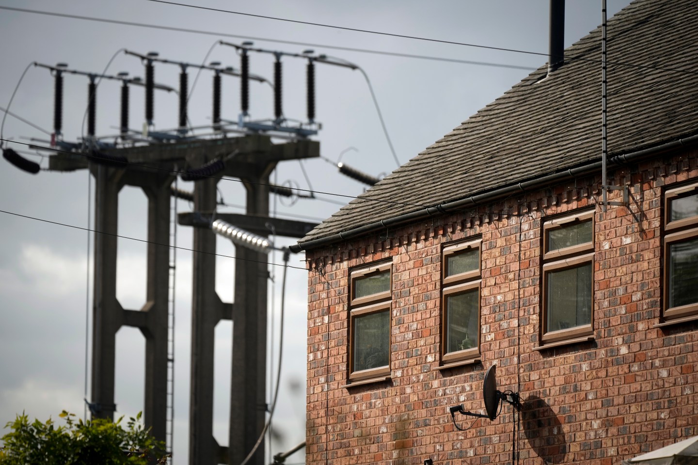 An electricity sub station pylon stands next to a home on October 11, 2022 in Burton On Trent, England.