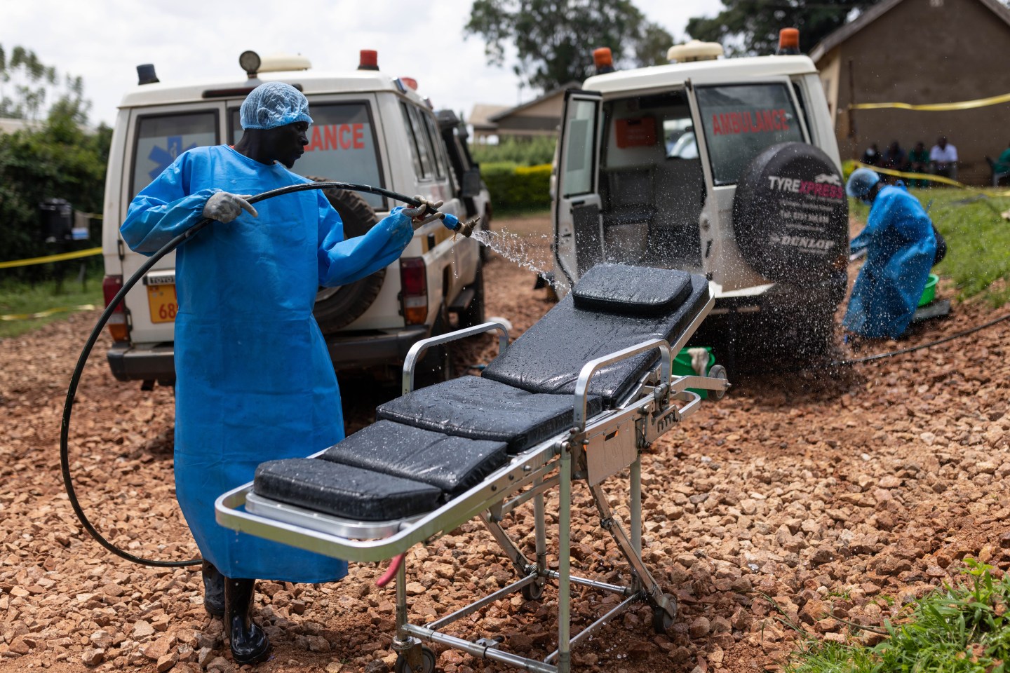 Red Cross workers clean ambulances prior to transporting Ebola victims to a hospital on Oct. 13 in Mubende, Uganda. Emergency response teams, isolation centers, and treatment tents have been set up by the Ugandan health authorities around the central Mubende district after 19 recorded deaths and 54 confirmed cases from an outbreak of the Ebola virus. The first death from this outbreak of the Ebola-Sudan strain of the virus was announced on Sept. 19, and as yet, there is no vaccine for this strain.