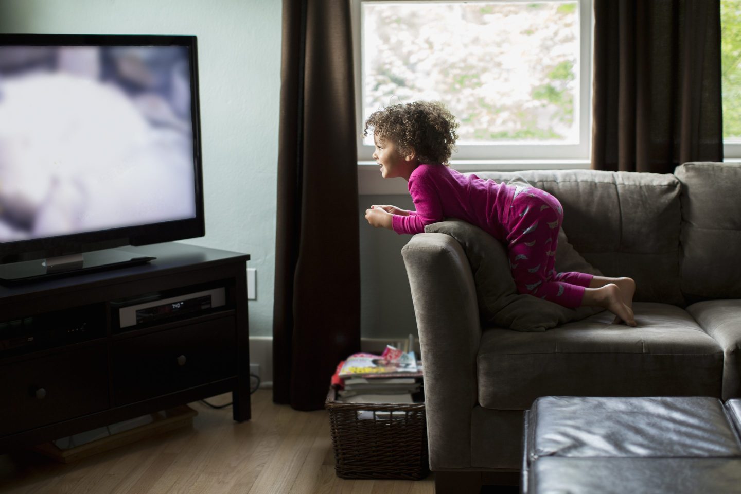 Little girl watching television.