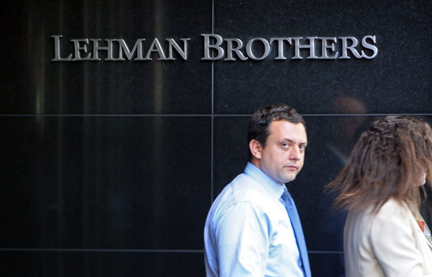 People walk past the headquarters of Lehman Brothers in Manhattan, days before the investment bank filed for Chapter 11 bankruptcy, triggering the Great Financial Crisis of 2008.
