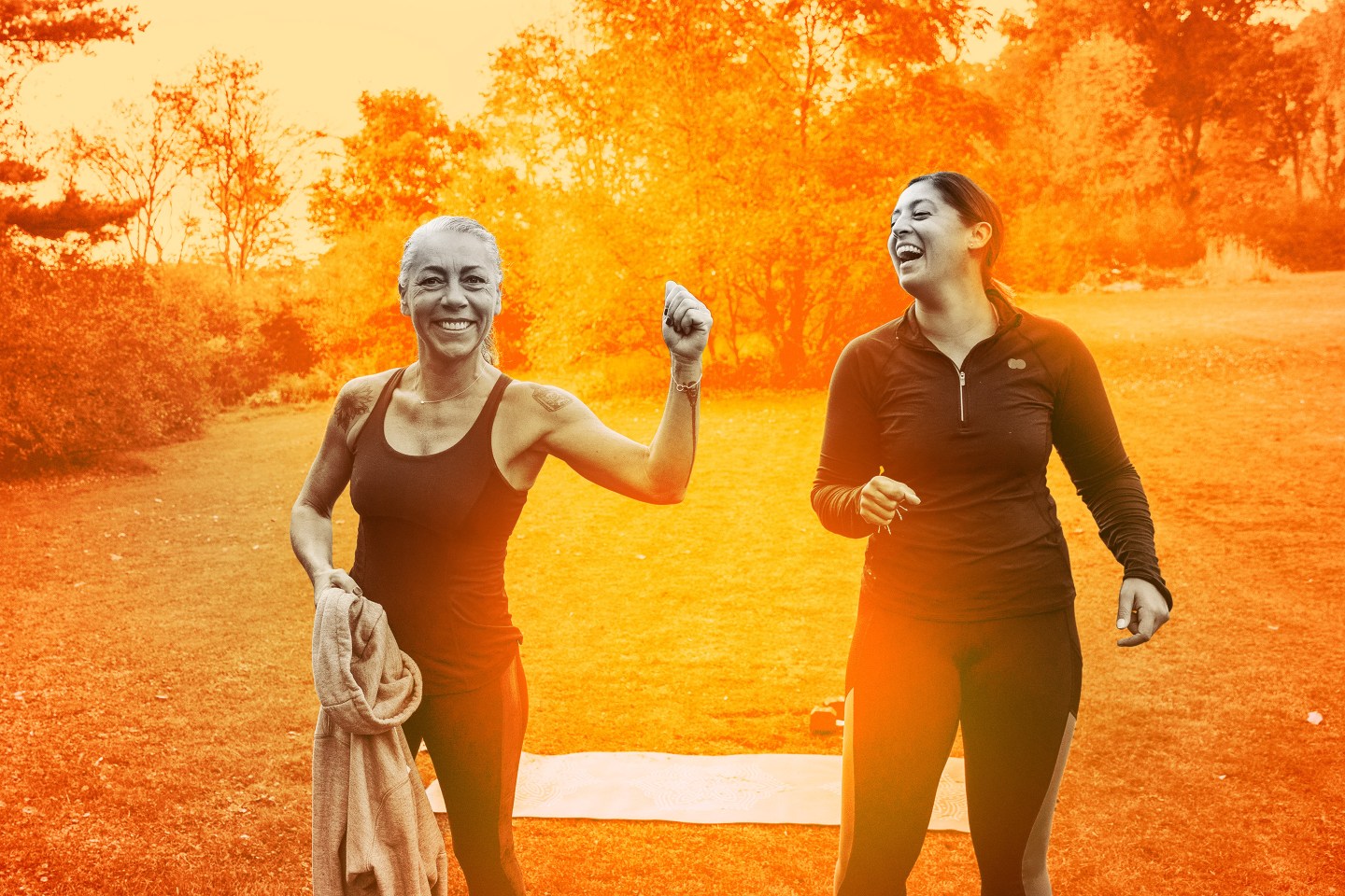 two women outside exercising and having fun