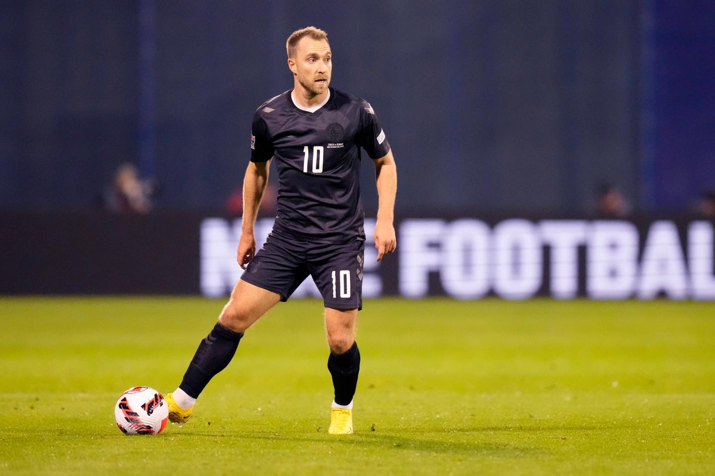 A soccer player wearing a black jersey.