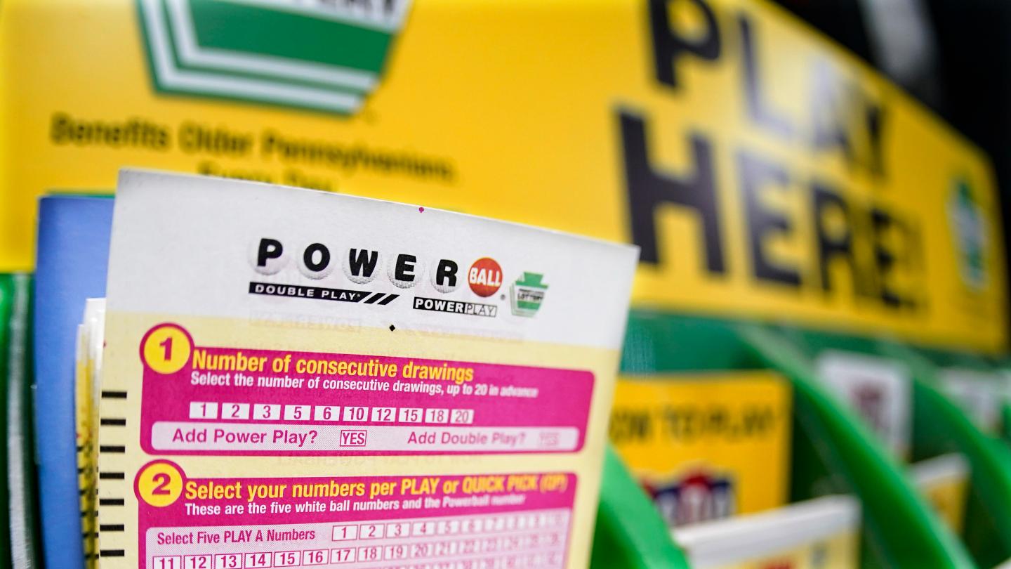 A rack with cards bettors can use to choose their own numbers to purchase lottery tickets for the Saturday Oct. 29, drawing of the Powerball lottery, are seen on a counter at a market in Prospect, Pa., on Oct. 28, 2022.