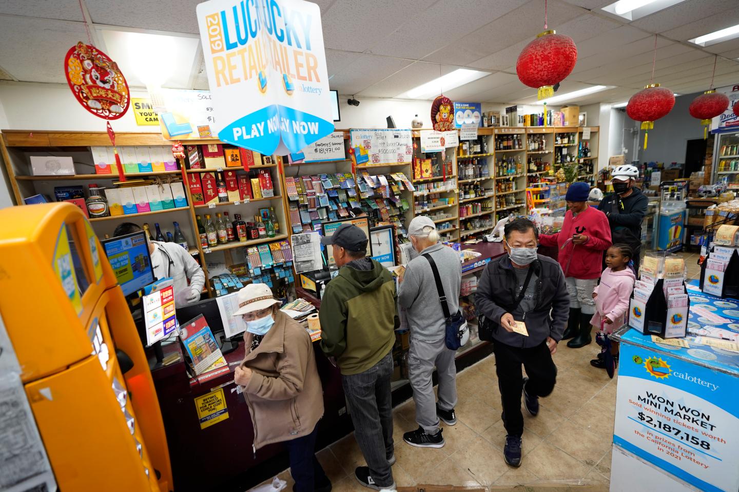 People standing in line to buy lottery tickets.