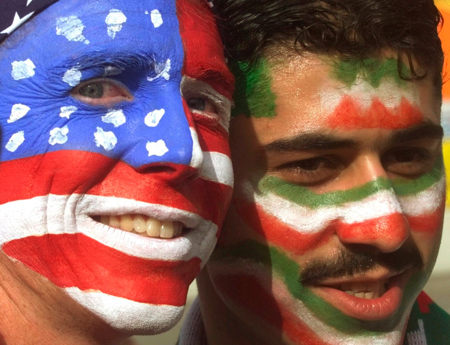 Mike Moscrop, left, from Orange County, Calif., poses with Amir Sieidoust, an Iranian supporter living in Holland outside the Gerlain Stadium in Lyon, June 21, 1998, before the start of the USA vs Iran World Cup soccer match. Iran defeated the U.S. 2-1 for its first World Cup win, eliminating them after just two games. A rematch between the U.S. and Iran will be played, Nov. 29, 2022.