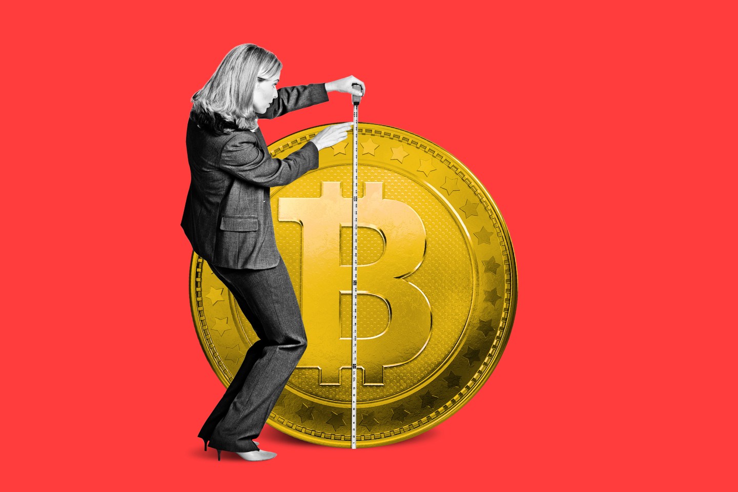 A woman measuring the height of a life-sized Bitcoin