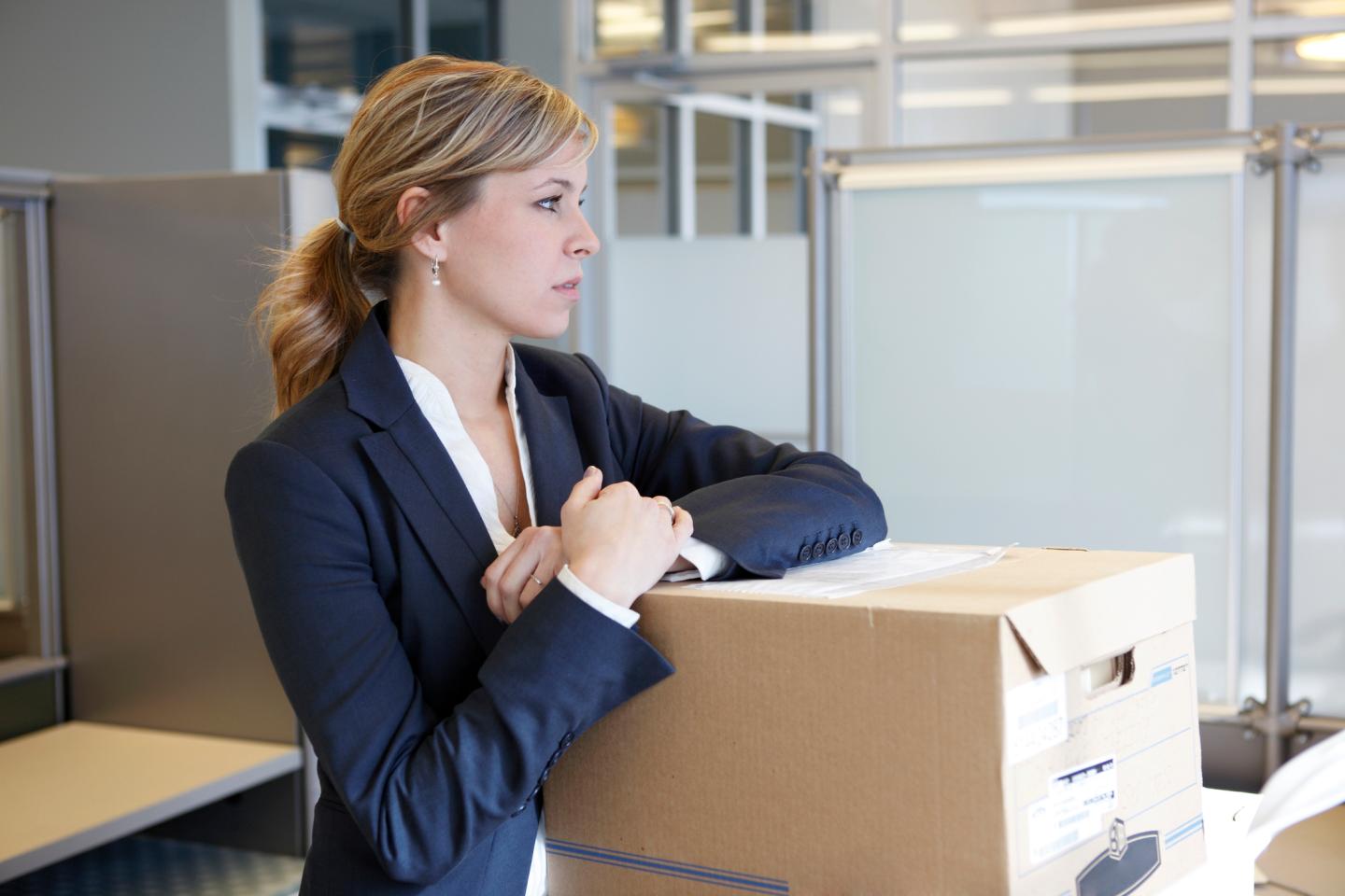 A woman with moving boxes.