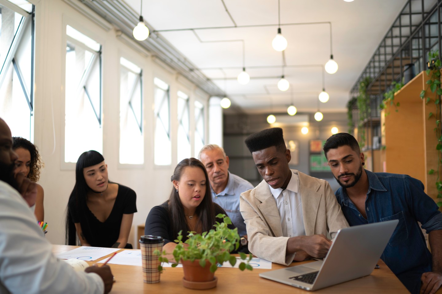 Young people at a table working together