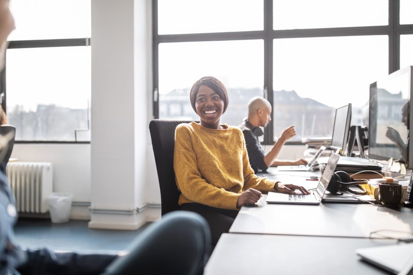 Businesswomen talking while working in office