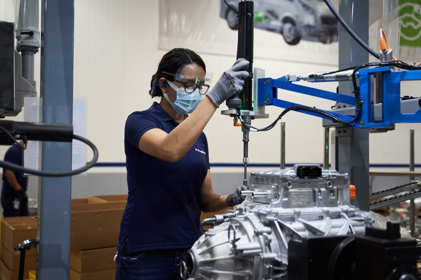 Shot of a worker assembling a vehicle component at a car manufacturing plant in Mexico