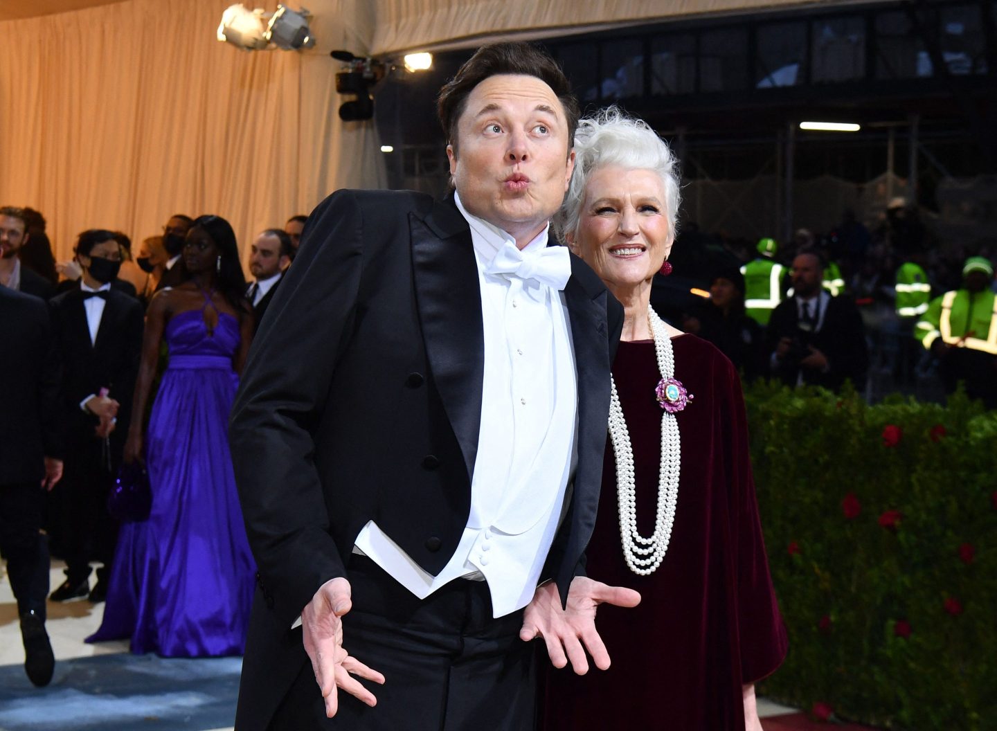 Elon Musk poses with his mother in May in New York.