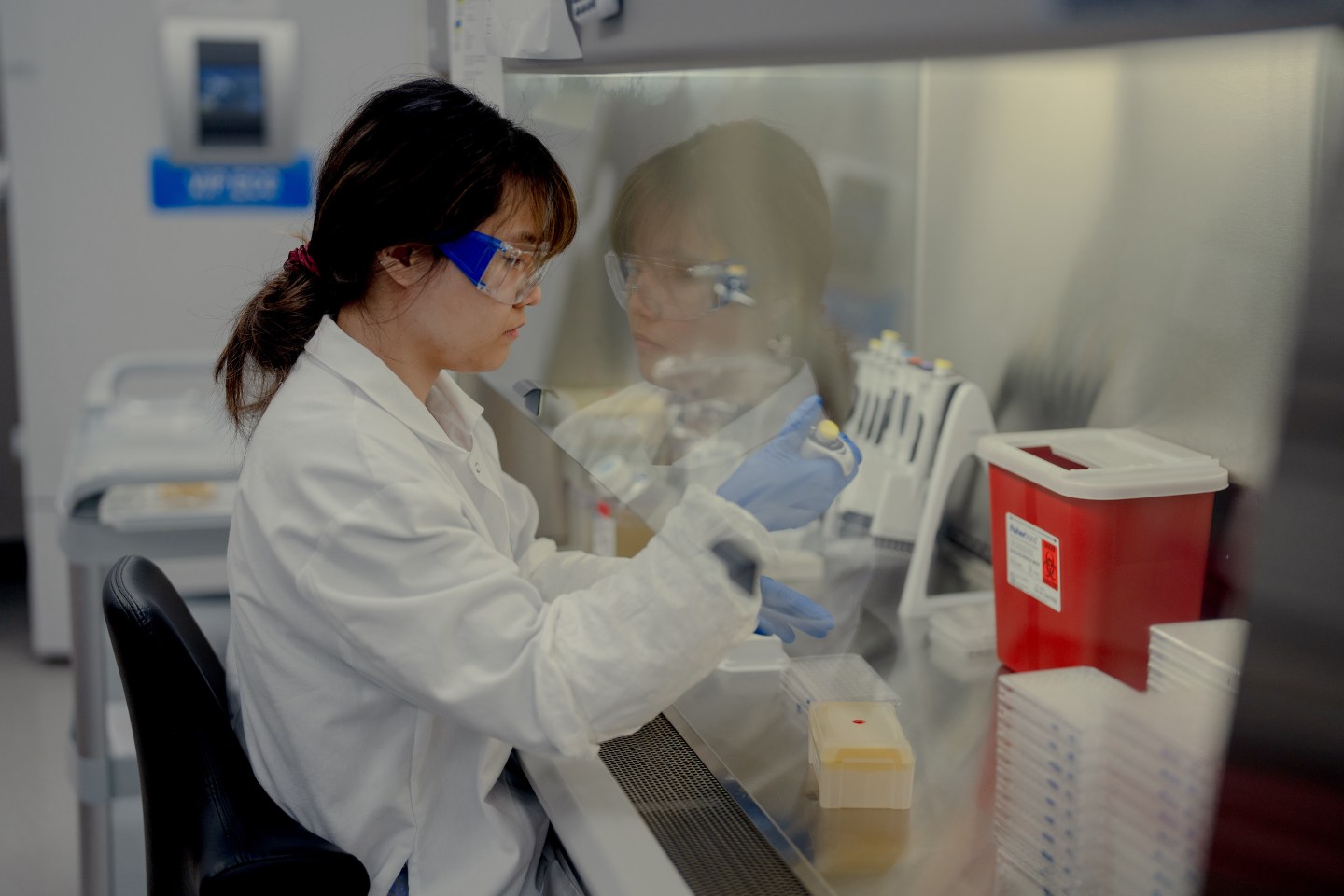 A scientist works at a Pfizer vaccine research and development facility.