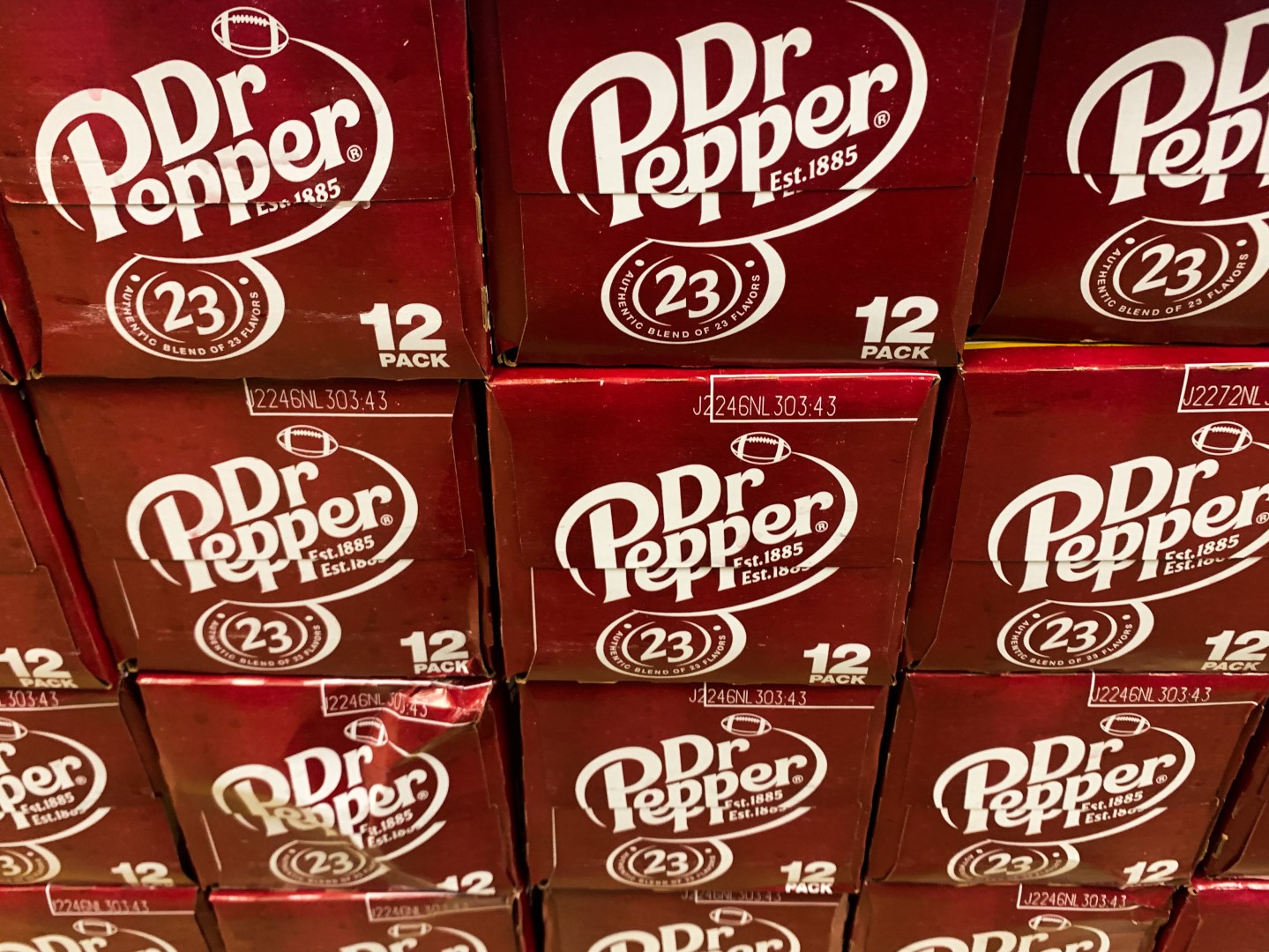 Dr. Pepper packaging are seen in a shop in Chicago. Cases of soda stacked on top of each other