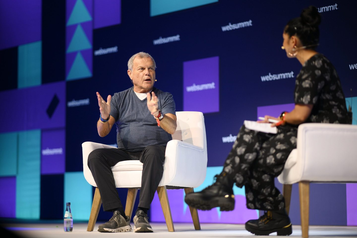 Sir Martin Sorrell, Founder & Executive Chairman of S4 Capital, and Nora Ali, Host of Business Casual, Morning Brew, on PandaConf stage during day two of Web Summit 2022 at the Altice Arena in Lisbon, Portugal.