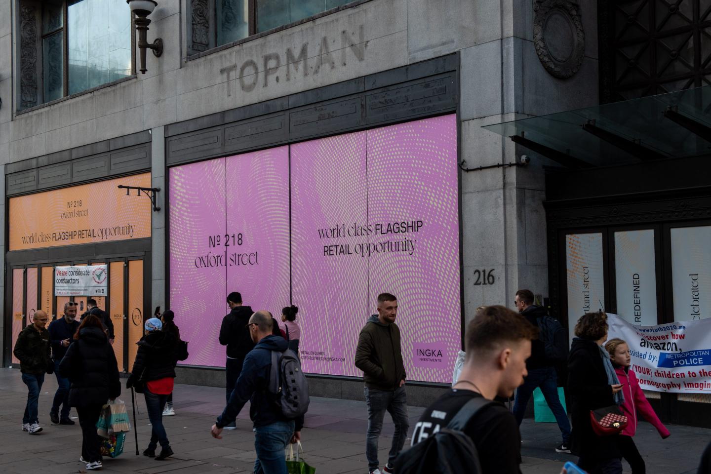Shoppers pass an empty retail unit on Oxford Street in London on Nov. 4.