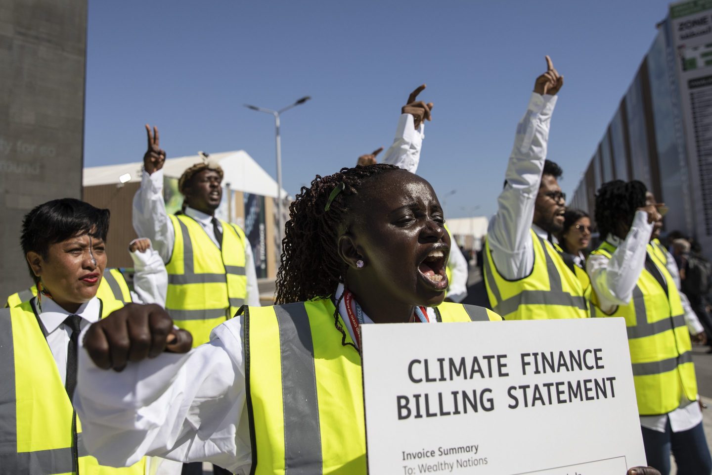 Activists shout slogans during a protest at the 2022 United Nations Climate Change Conference COP27