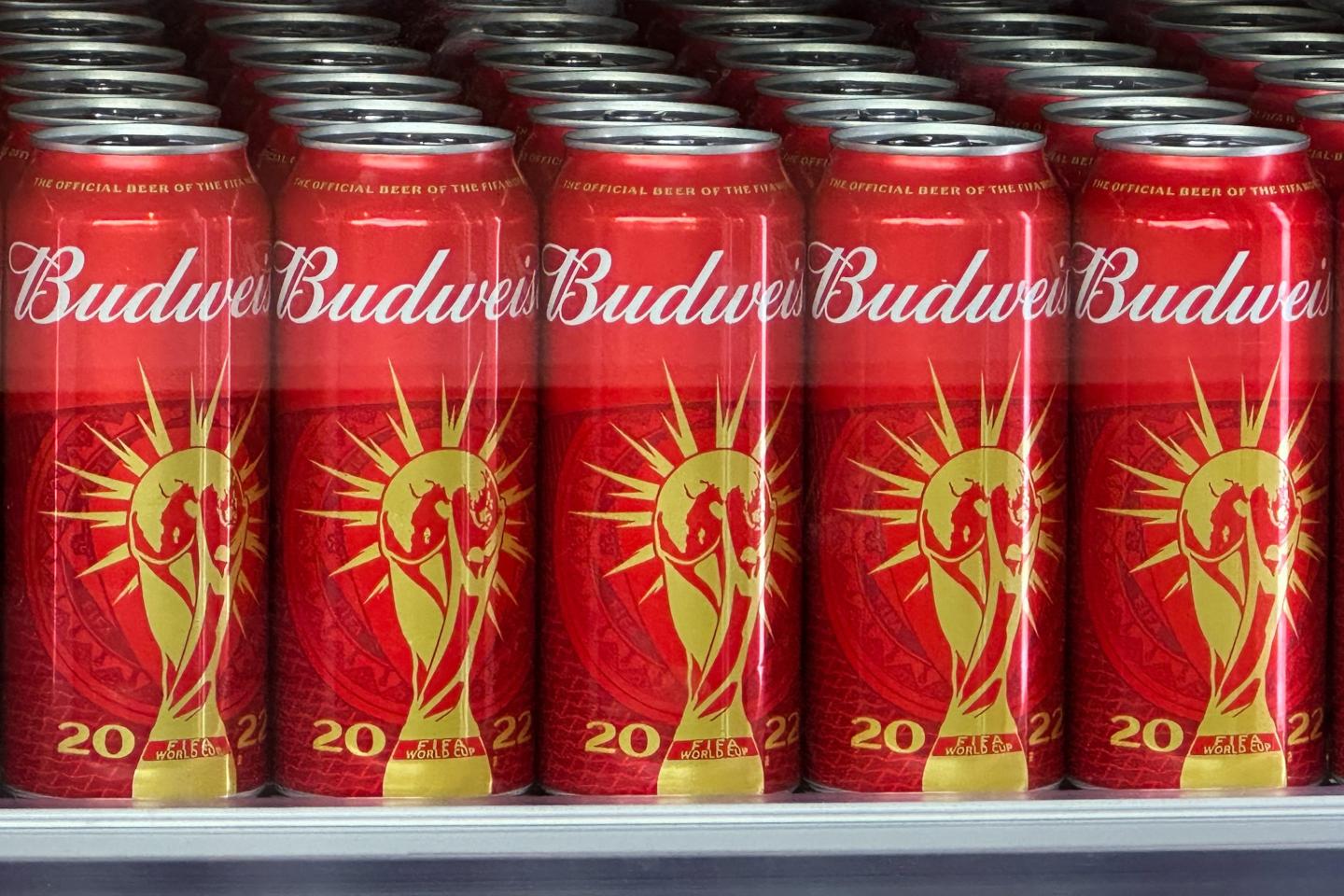 Cans of Budweiser beer featuring the FIFA World Cup logo are displayed in Doha